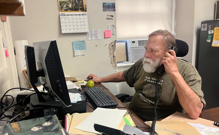 Bill Galvin answers calls at his desk in Washington, D.C.