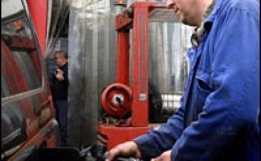 Biofuel producer Tom Lasica fills a car in London with biodiesel made from vegetable oil waste from local catering companies, restaurants and pubs.
