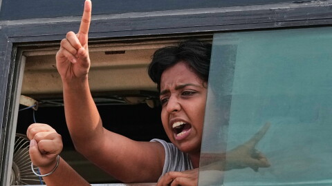 A protester shout slogans as they are detained and taken in a police vehicle during a protest demanding the resignation of Chief Election Commissioner Gyanesh Kumar in New Delhi, India, Saturday, Oct. 10, 2026.
