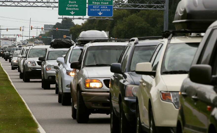 Vehicles sit in traffic on the Croatan Highway as people evacuate the Outer Banks area Thursday in Southern Shores, N.C.