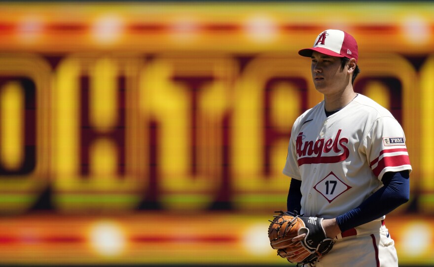 Los Angeles Angels starting pitcher Shohei Ohtani gets set to pitch during the first inning in the first baseball game of a doubleheader against the Cincinnati Reds on Wednesday, in Anaheim, Calif., before an MRI exam revealed his elbow tendon tear.