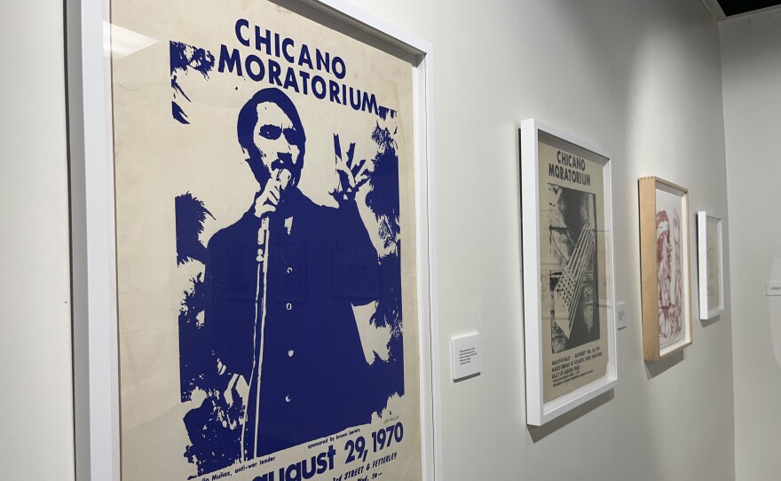 Original artwork from the Chicano Moratorium hangs on the walls inside the “Fragmentos del Barrio" gallery, Aug. 29, 2025.