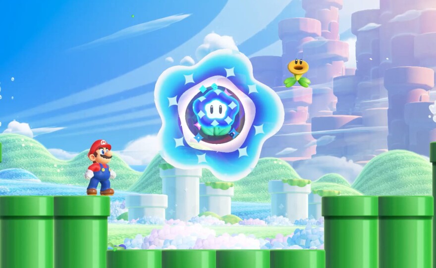 Mario and a Talking Flower contemplate the Wonder Flower that will soon rock their world.