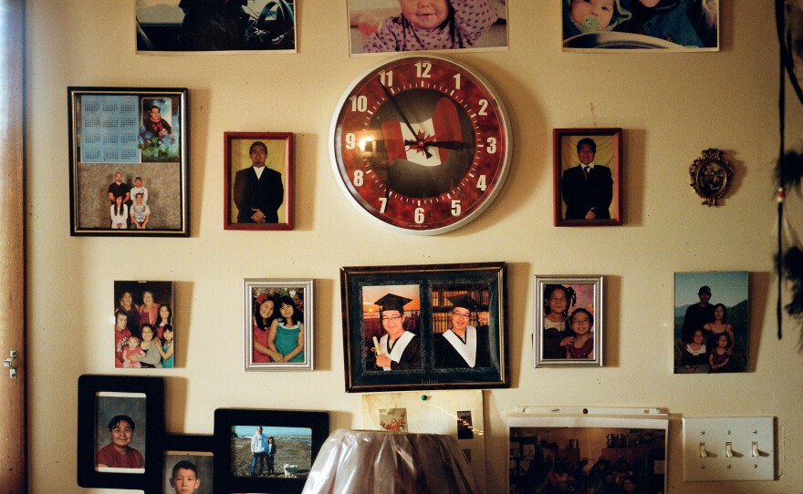 Family photos are on display in Walter Inglangasak's home.