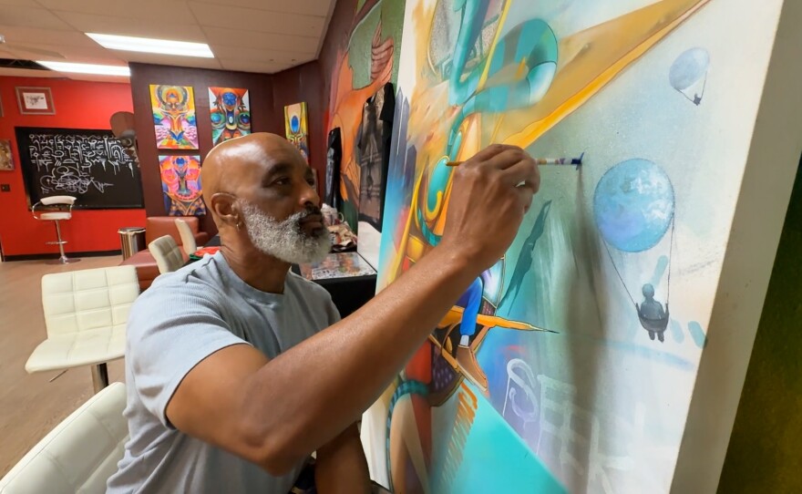 Maxx Moses working in the interior studio space of Graffiti Gardens. Nov. 17, 2025