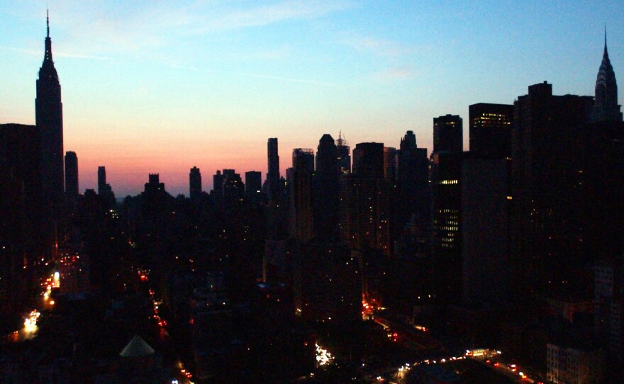 The New York City skyline is mostly dark in this photo of the 2003 blackout that hit U.S. and Canadian cities.