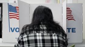 A person marks their ballot at a polling place in Falls Church, Va., during early voting for the 2024 election.