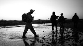 Marines of the 2nd Battalion, 8th Regiment, walk across a stream during a dawn patrol in the farm fields of Afghanistan's Helmand River valley. Now that the disputed Afghan presidential election has been settled, President Obama must decide whether to send more U.S. troops to Afghanistan.