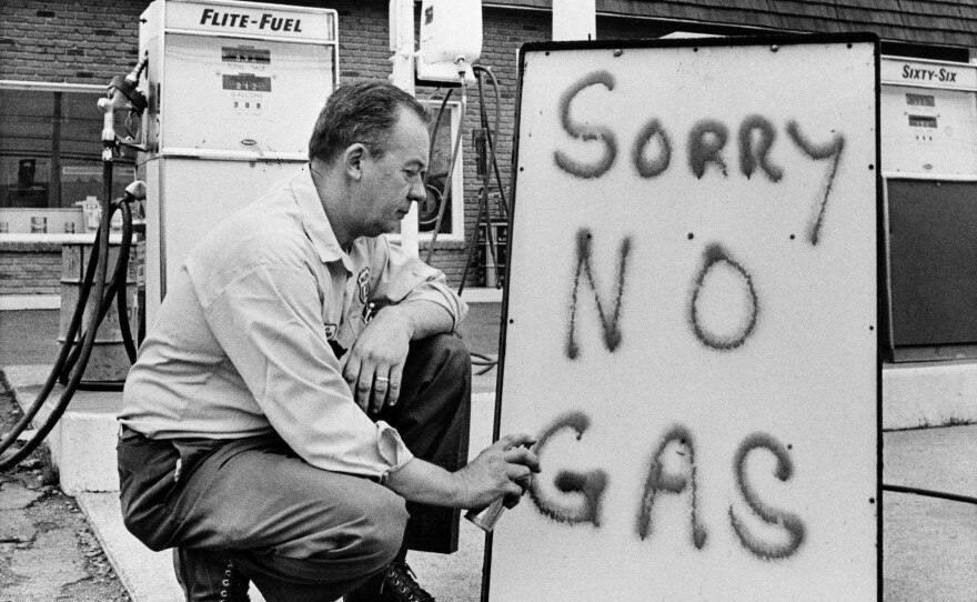 Leon Mill spray-paints a sign outside his Phillips 66 station in Perkasie, Pa., in 1973 to let his customers know he's out of gas. An oil crisis was the culprit, squeezing U.S. businesses and consumers who were forced to line up for hours at gas stations.