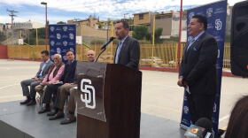 Members from the San Diego Padres and Major League Baseball, along with Tijuana officials, unveil outreach plans in Mexico on Jan. 13, 2016. 