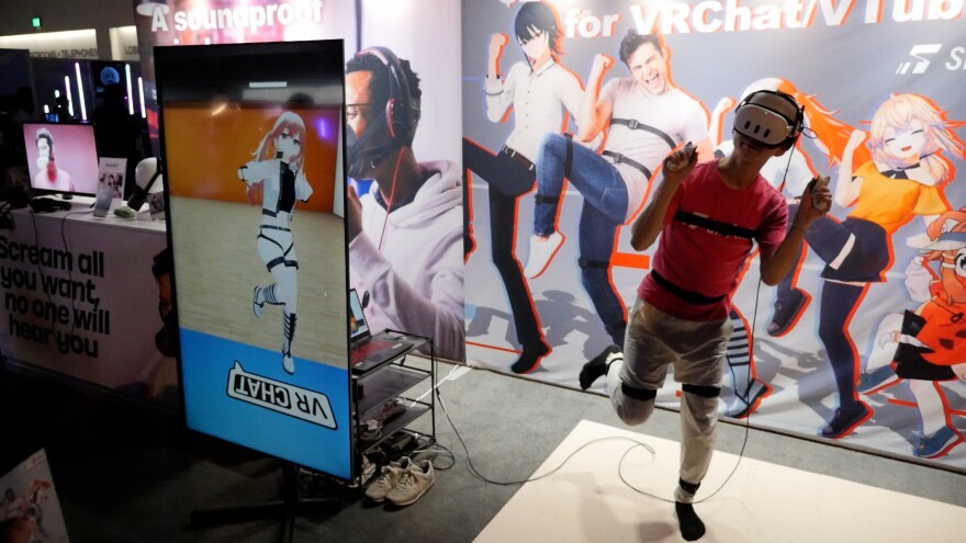 A TwitchCon attendee tries out a VR product on Sept. 20, 2024 at the San Diego Convention Center.