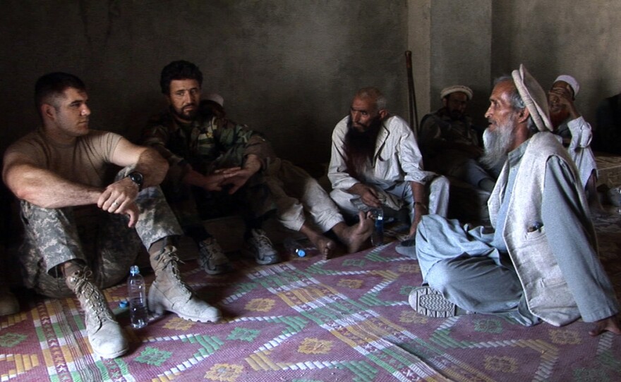 The soldiers meet with local Afghan villagers in "Restrepo"
