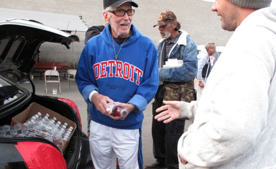 David Ross, also known as Waterman Dave, hands out bottled water and energy drinks from his trunk in San Diego. The 75-year-old retiree has made it his mission to help the homeless — even if it's just with a hug or a kind word.