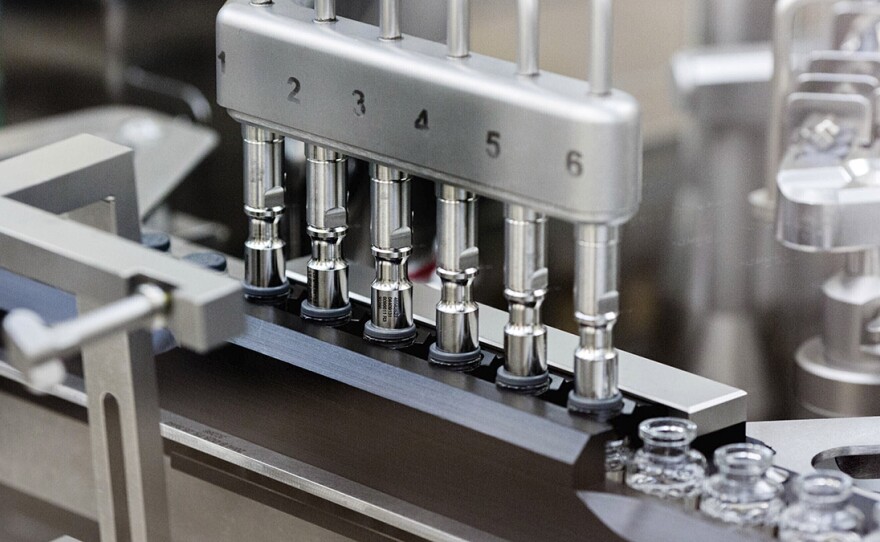 Stoppers are placed on filled vials of the experimental drug remdesivir at a Gilead Sciences factory in this undated photo. 