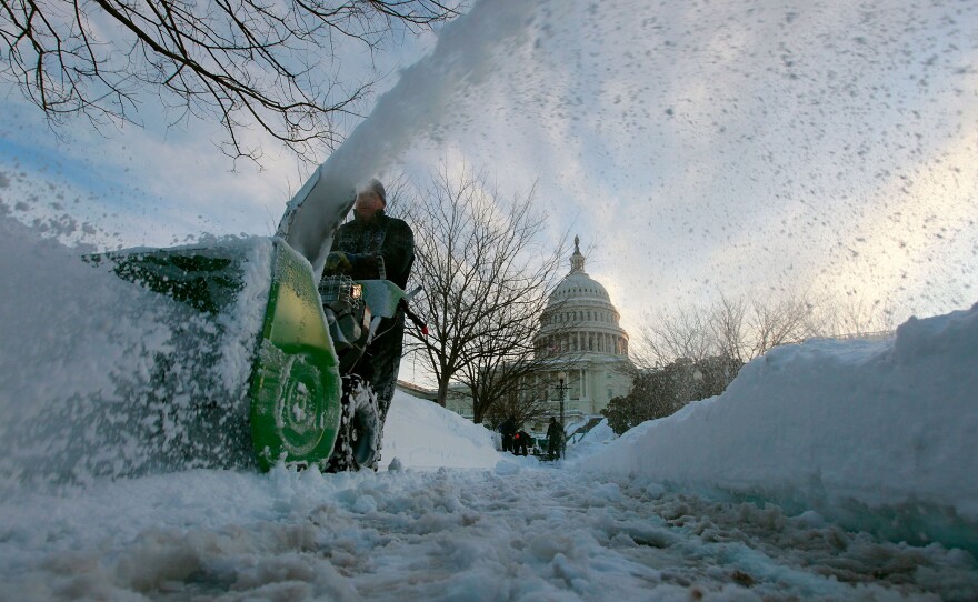 Capitol grounds worker Kevin Trodden uses a snow blower to clear side walks at the US Capitol on February 11, 2010 in Washington, DC. Washington was hit with a second snow storm in a week leaving a foot of snow and causing wide spread power outages.