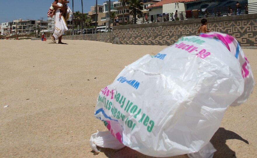 Blowing across the sand in Manhattan Beach, Calif.