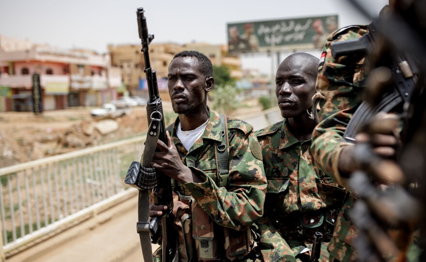 Sudanese Armed Forces soldiers travel to Khartoum in the back of a Toyota pickup truck in Omdurman, Sudan, on Sept. 7.