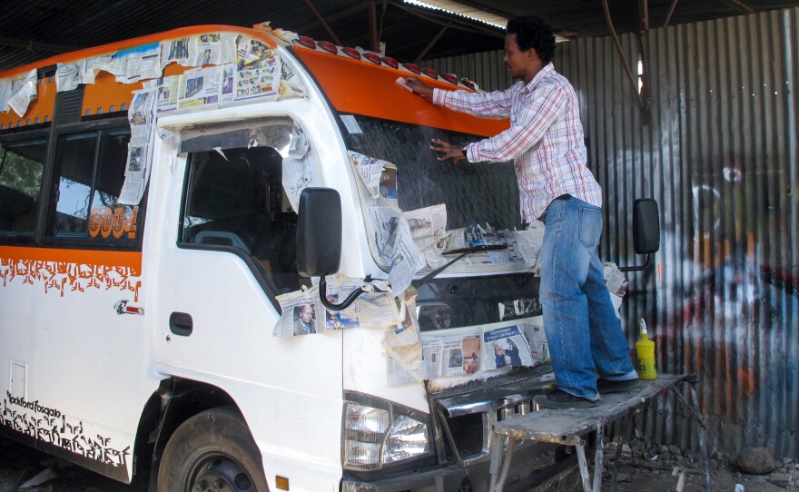 Roy Mungai (a.k.a. Great) adds color to the windshield.