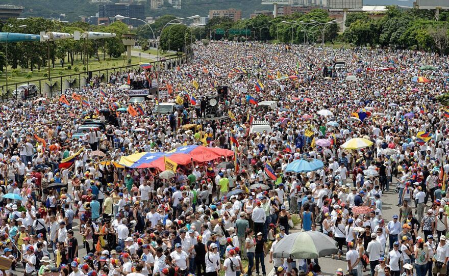 Opponents of Maduro rallied in the streets as the leftist leader convened a crisis security meeting resisting their efforts to drive him from power.