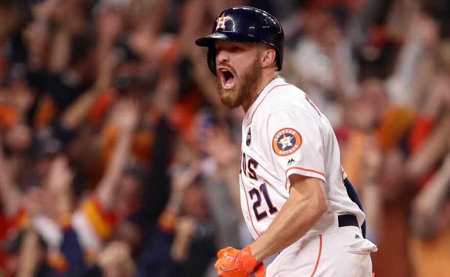 Derek Fisher of the Houston Astros celebrates after scoring the winning run during the 10th inning against the Los Angeles Dodgers in Game 5 of the World Series.