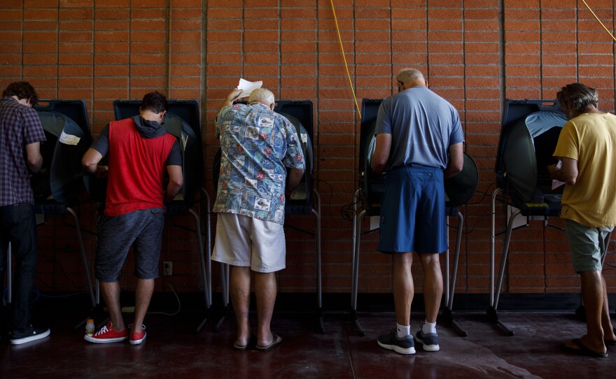 Voters cast ballots at a polling station in Newport Beach, Calif., on Tuesday.