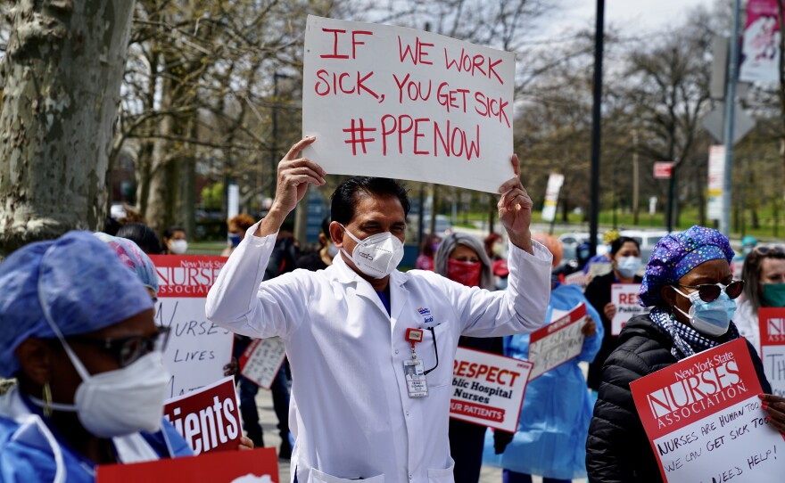 Public health workers, doctors and nurses protest a shortage of personal protective equipment outside a hospital in the Bronx on April 17 in New York City.