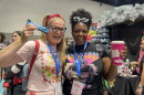 Sam Ginn and Melissa Coleman-Reed display their Comic-Con survival snacks: a protein bar for Ginn and coffee for Coleman-Reed in this undated photo.
