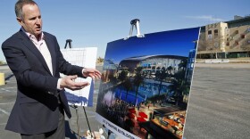 Chris Meany, senior vice president of Hollywood Park Land Co., unveils an architectural rendering of a proposed NFL stadium at Hollywood Park in Inglewood, Jan. 5, 2015. 