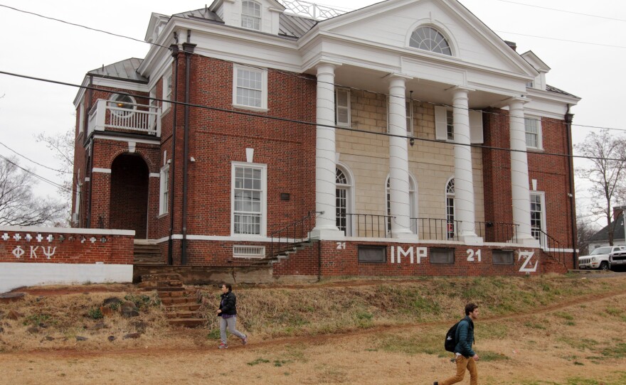 Students walk past the Phi Kappa Psi fraternity house on the University of Virginia campus on December 6, 2014 in Charlottesville, Va. The fraternity was at the center of an explosive Rolling Stone article that the magazine later admitted had "discrepancies."