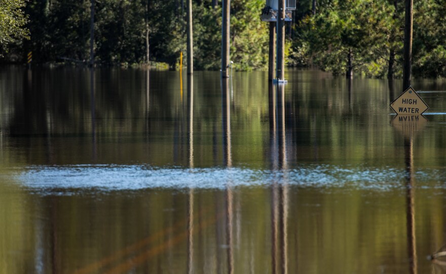 A street in Lumberton, N.C., was flooded on Monday. Torrential rains are continuing to fuel floods, days after Hurricane Matthew barreled up the U.S. coast and then headed out to sea.