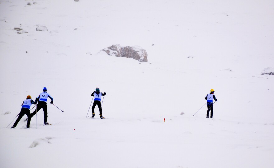 Teenagers compete in a sprint biathlon in Nuuk, Greenland, during the Arctic Winter Games.