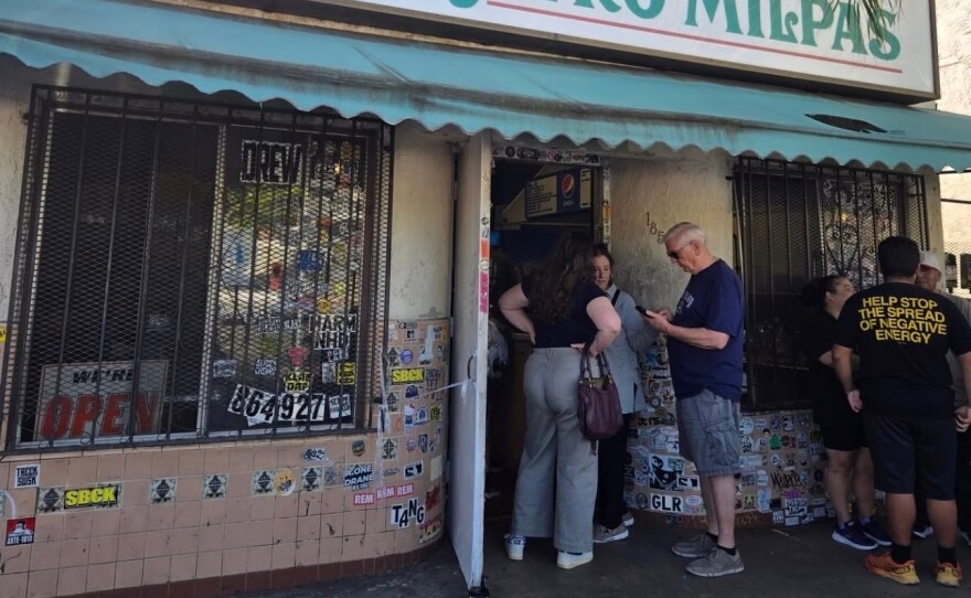 A line of people wait to order at the former location of Las Cuatro Milpas in this undated image.