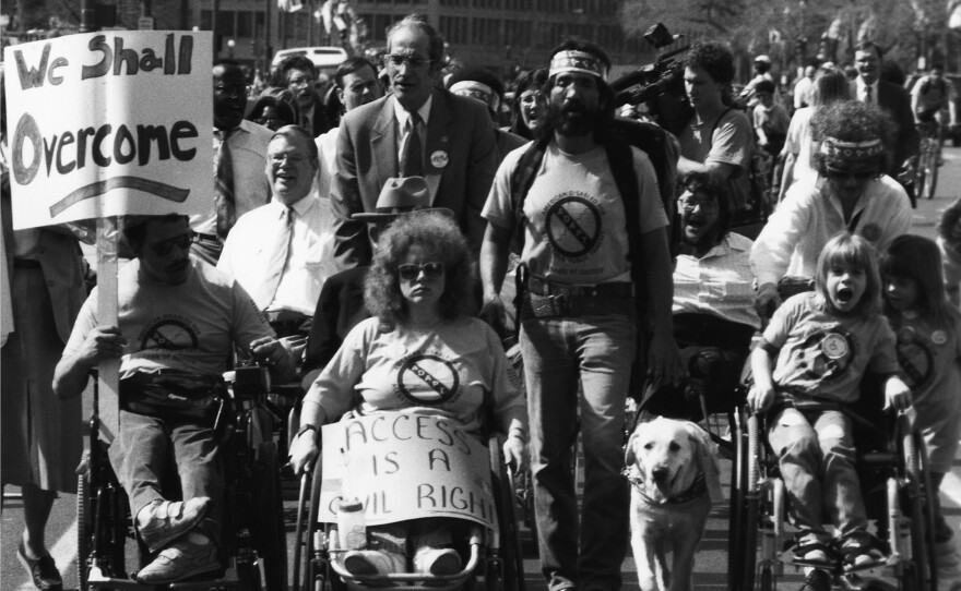 People with disabilities march in March 1990 at the Wheels of Justice and Capitol Crawl protests ahead of the passage of the Americans with Disabilities Act.