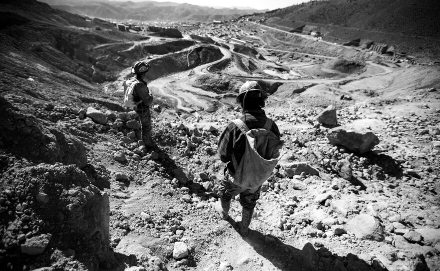 Young miners head home after working inside Cerro Rico. In Potosí, Marston says children often attend school while also working in the mines. "They go underground in the morning and night, then they go to school in the day," says Marston. She says some children work in the mines "because they have a father who has been killed, and they need money."