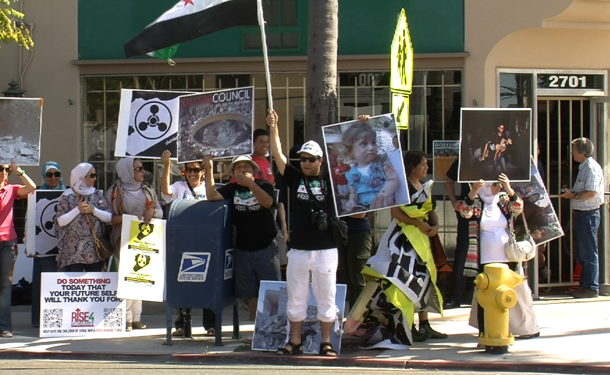 People rally outside of Rep. Susan Davis' (D-Calif.) office to urge support for U.S. military action in Syria, on Sept. 6, 2013,