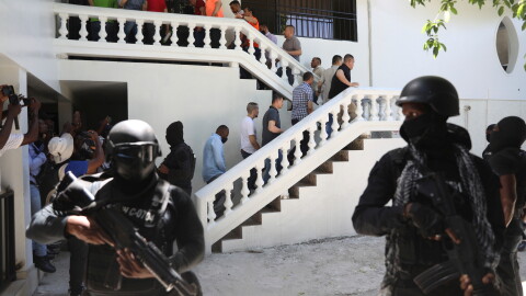 FILE - Colombians and Haitians who are accused of involvement in the 2021 assassination of Haitian President Jovenel Moise are escorted in handcuffs to their court hearing in Port-au-Prince, Haiti, May 26, 2025.