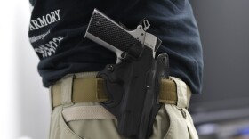 Mike Weinstein, director of training and security at the National Armory gun store and gun range, has a Ruger 1911 hand gun in a holster as he teaches a Concealed Weapons Permit class in Pompano Beach, Fla., Jan. 5, 2016.