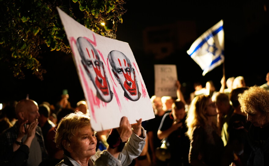 Israeli left-wing activists call for a government with Arab parties outside Yashar party leader Gadi Eisenkot's residence in Herzliya, Israel, Thursday.