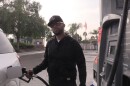 Jovanim Martinez fueling up his car in Chula Vista, Nov. 18, 2021.