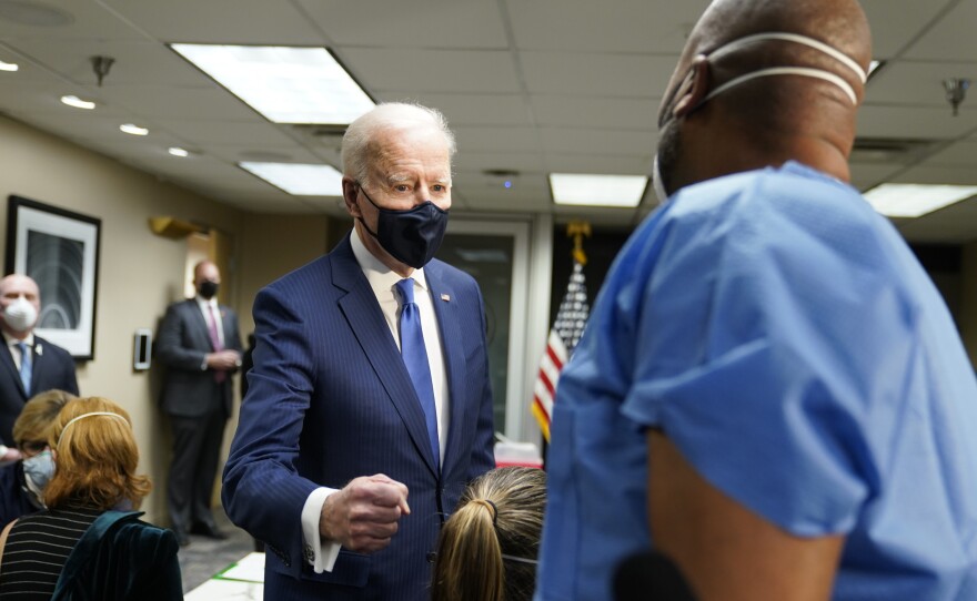 President Biden talks to recently vaccinated Army Staff Sgt. Marvin Cornish as he visits a COVID-19 vaccination site at the VA Medical Center in Washington, D.C., on Monday.