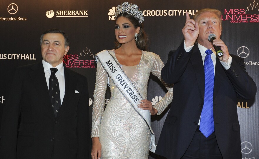 Russian businessman Aras Agalarov, left, Miss Universe Gabriela Isler and pageant owner Donald Trump at the Miss Universe pageant in Moscow in 2013. It was there that Trump — then the pageant's owner — spent several days hobnobbing with Russia's elite.