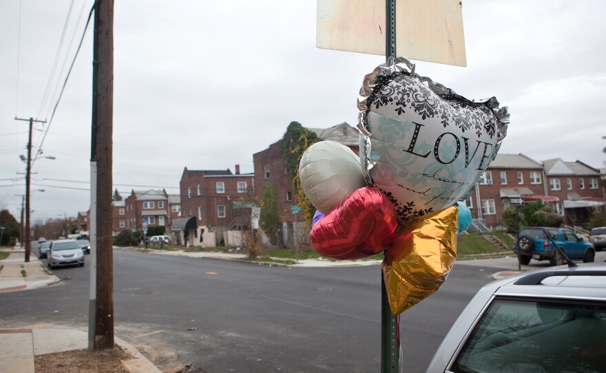 A memorial is seen on West Baltimore street at the site of the city's 300th homicide this year, Wednesday, Nov. 19, 2015 in Baltimore, MD.