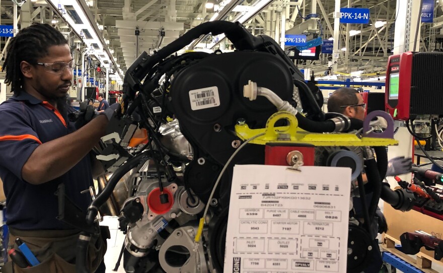 Tremaine Smalls attaches parts to an engine at Volvo's plant in Ridgeville, S.C. The automaker has shifted its exports to Europe as the result of the U.S. trade war with China.
