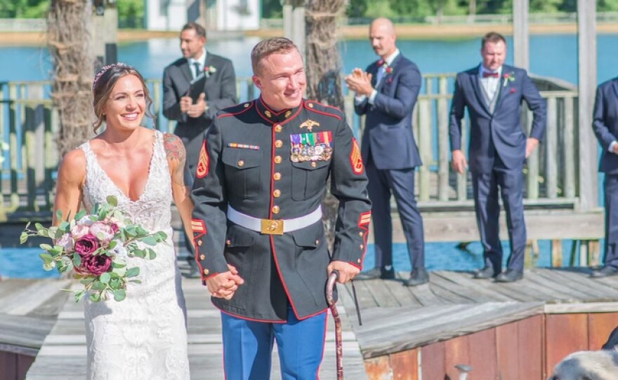 Hanah and Nick walk down the aisle on their wedding day, Sept. 5, 2020. Nick was prescribed pain medication and antidepressants but didn't take them that day, so he could be emotionally present throughout the day.