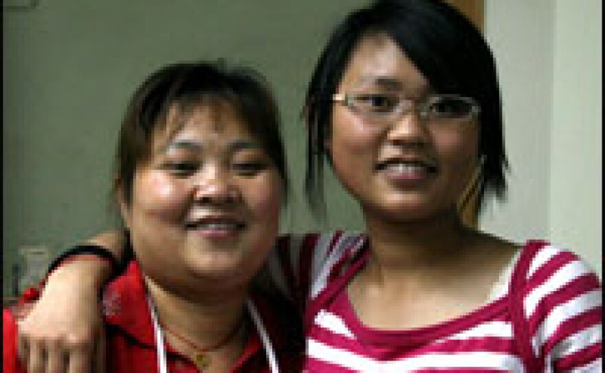 Bamboo (right), who is an only child, stands with her mother.