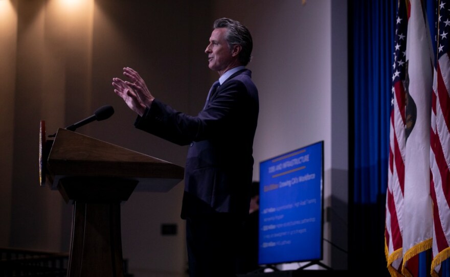 Gov. Gavin Newsom presents the breakdown for his revised budget at the Secretary of State building auditorium in Sacramento on May 14, 2021. The proposal focused on education, housing and climate resiliency measures.