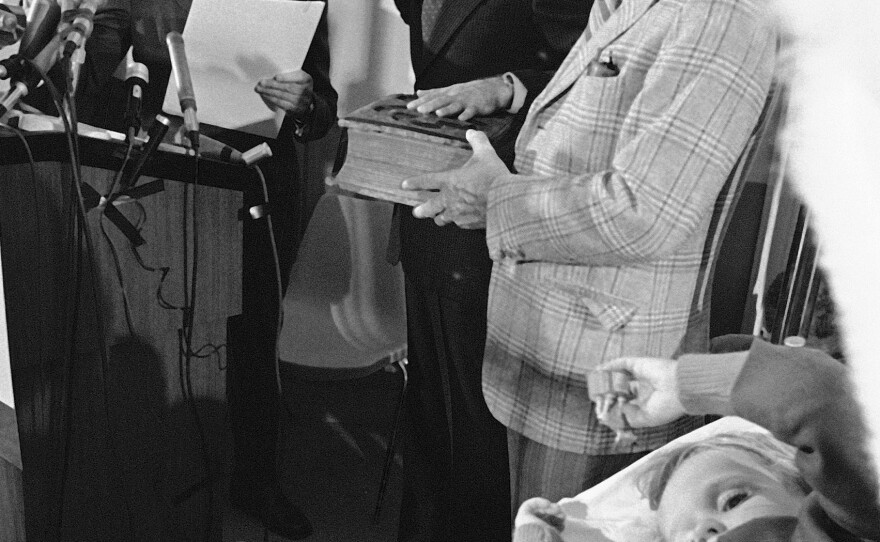 Joe Biden takes the oath of office in 1973 for the U.S. Senate in his sons' hospital room following a car crash that killed his wife and daughter. In the foreground, is his then-4-year-old son Beau.