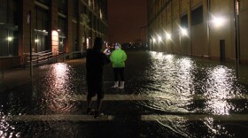 Picture-takers were out Monday night in Manhattan, where some streets were flooded.
