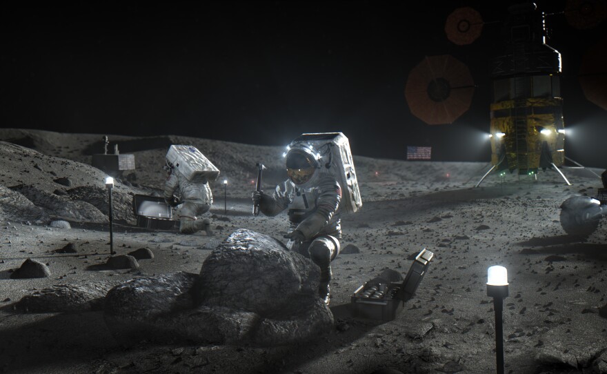 This illustration made available by NASA in April 2020 depicts Artemis astronauts on the Moon. On Thursday, NASA announced the three companies that will develop, build and fly lunar landers, with the goal of returning astronauts to the moon by 2024.