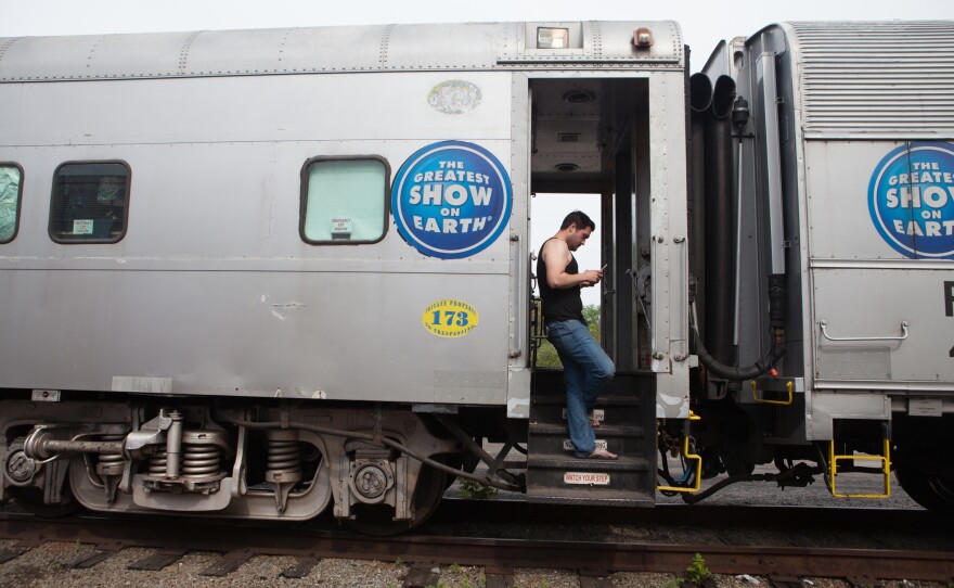 Audio engineer Jeff Bell, 33, hangs out on the train the day of a performance.